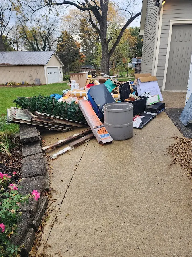 Dumpster being loaded with debris for Estate Cleanout Dumpster Rental in Morrison